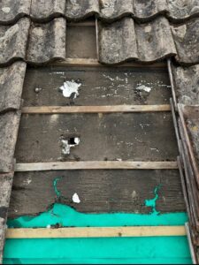 Replacing damaged roof felt and sarking with new breathable membrane during roof repair in North Yorkshire