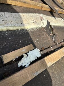 Close-up of timber battens fixed over roofing membrane with foam residue during roof preparation in Nottinghamshire