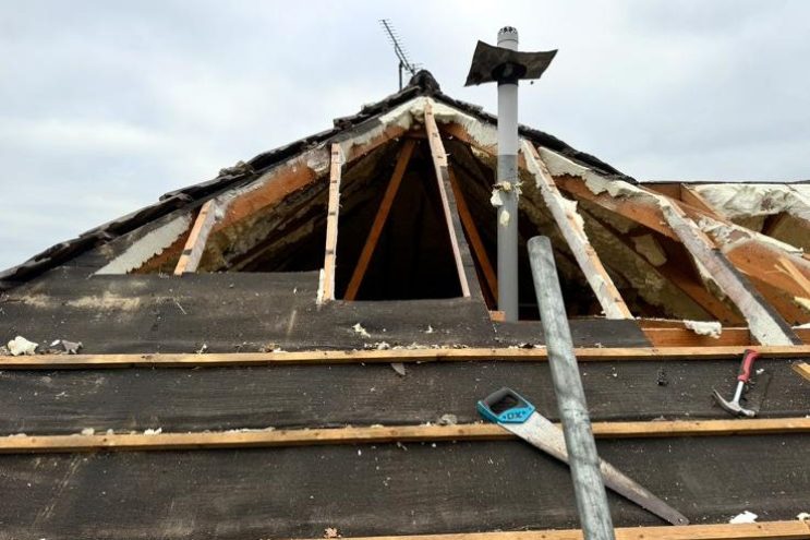 Spray foam insulation removal in East Riding of Yorkshire, showing exposed roof rafters and gable end structure after foam extraction