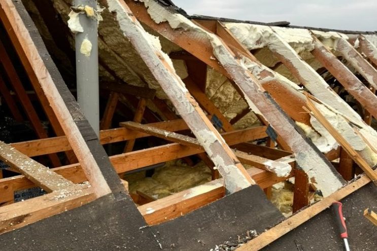 Spray foam insulation removal in Gloucestershire, showing exposed timber rafters and roof structure after foam extraction, professional roof restoration service