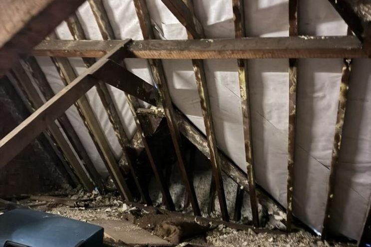 Spray foam insulation removal in Wiltshire showing timber roof rafters and loft clearance, professional attic restoration and insulation extraction service